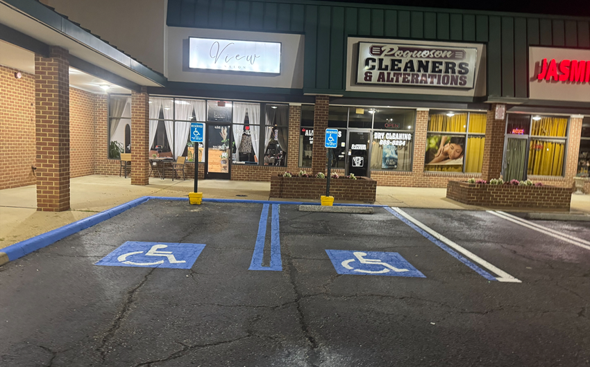 Clearly marked ADA-compliant parking spaces with blue and white striping.
